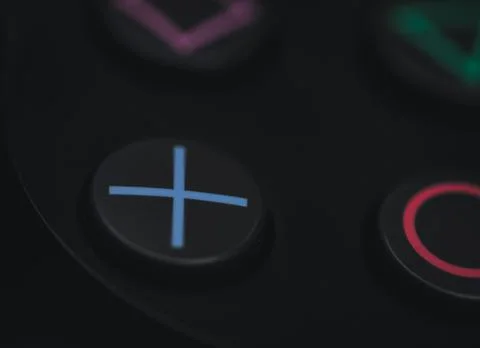 Closeup shot of an x button on a game controller Stock Photos