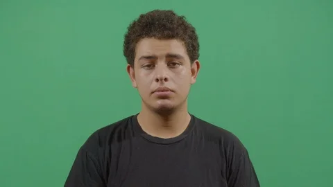 Closeup shot of an young boy face expressing sadness in ecuador Stock Footage 115337621