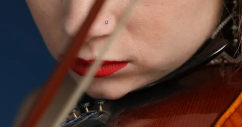 Closeup shows violinist's focus and instrument mastery Stock Footage 251114493