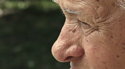 Closeup side portrait of an old man: eyes of elderly man, pensive old man Stock Footage 64171935