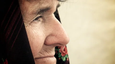 Closeup side portrait of a sad old woman: caucasian elderly woman Stock Footage 64276418