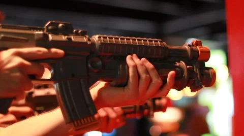 Closeup Side Shot of 2 People Playing Shooting Game 2 Stock Footage 49148879
