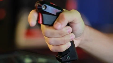 Closeup Side Shot of Person Playing Space Arcade Game 2 Stock Footage 49147974