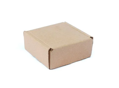 Closeup side view of a cardboard box isolated on white background Stock Photos