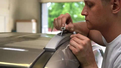 Closeup side view of focused experienced technician male expertly repairing Stock Footage 284570095