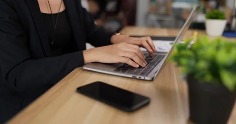 Closeup side view of hands typing on keyboard laptop pc while sitting  Stock Footage 201987808