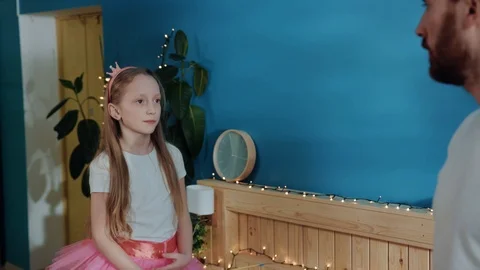 Closeup side view little amazing girl princess posing like ballerina on bed Stock Footage 112269847