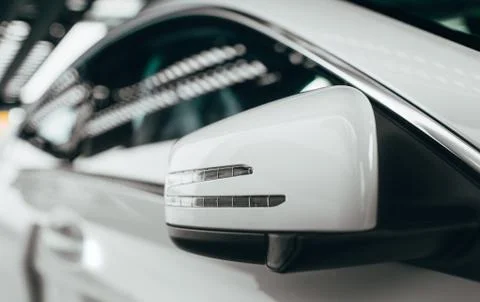 Closeup Side view mirror in modern car. of powerful luxury sport car,  sides  Stock Photos