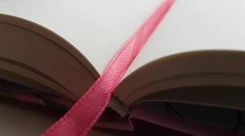Closeup side view of an new diary with blank sheets and pink bookmark. 스톡 사진