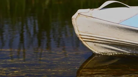 Closeup side view of the nose front part of a kayak floating in the river Stock Footage 163605045