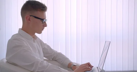 Closeup side view portrait of young handsome caucasian businessman in glasses Stock Footage 111318066