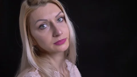 Closeup side view shoot of midddle aged caucasian female with blonde hair Video stock 104426059