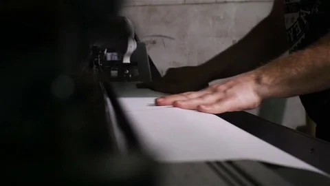 Closeup Side View Worker Loads Paper into Plotter by Hands Stock Footage 83403111