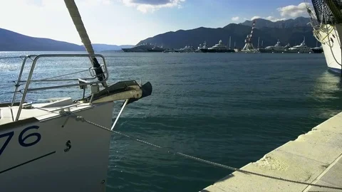 Closeup sideview of a anchor in the prow of a sailboat Stock Footage 84995477