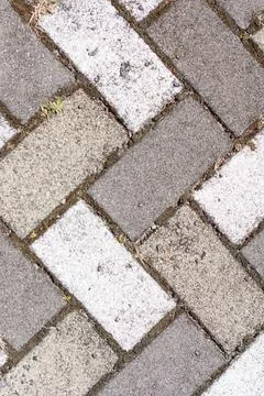 Closeup of sidewalk paved with rectangular white and gray tiles in top view 스톡 사진