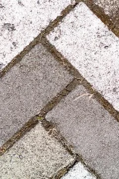 Closeup of sidewalk paved with rectangular white and gray tiles in top view 스톡 사진