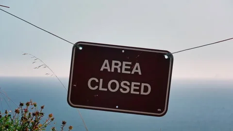 Closeup of sign warning the area is closed Stock Footage 304254963