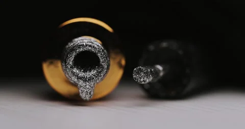 Closeup of silver glitter nail polish with an open bottle and a drop dripping Stock Footage 149368065