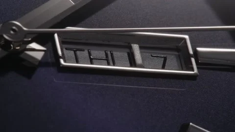 Closeup of silver second arrow passing by calendar Stock Footage 152078901