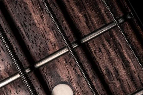Closeup of the silver strings of a bass guitar Stock Illustration