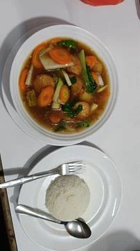 Closeup of simple dish and side dishes on the table Stock Photos