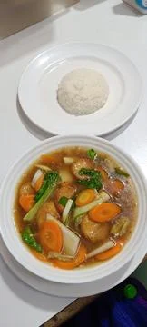 Closeup of simple dish and side dishes on the table Stock Photos