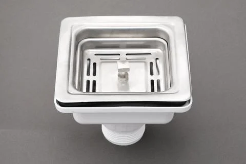 Closeup of sink waste coupling square chrome stainless silver floor drain i.. Stock Photos