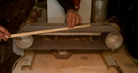 Closeup of skilled carpenter working with abrasive sanding machine Stock Footage 122553364