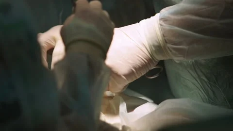 Closeup skilled surgeon stitches up wound at operating 스톡 동영상 101295754