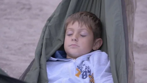 Closeup of sleeping child in hammock Stock Footage 79223569