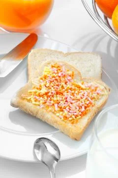 Closeup of a slice of bread with candies Stock Photos