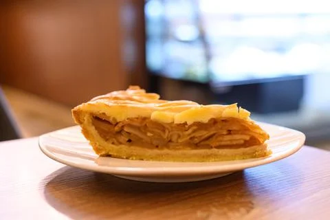 Closeup of a slice of cinnamon apple pie on a plate. Stock Photos