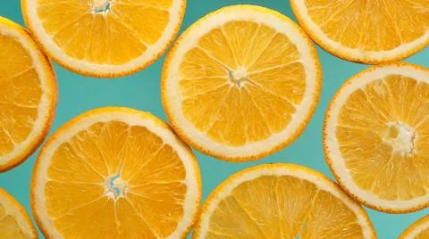 Closeup slice of orange fruit background,pattern background Stock Photos