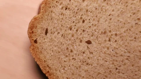 Closeup of a slice of rye bread Stock Footage 128184984