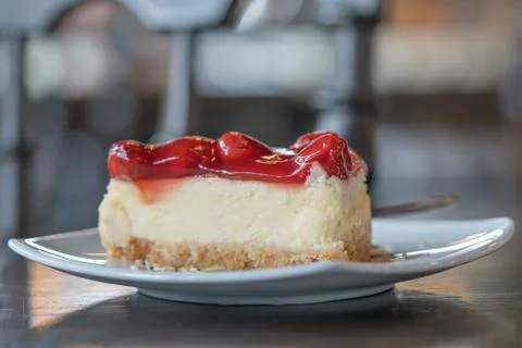 Closeup Slice Strawberry cheesecake layer cake Dessert Food on a white plate Stock Photos