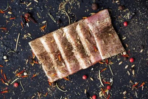 Closeup slices of breast with spices. Stock Photos