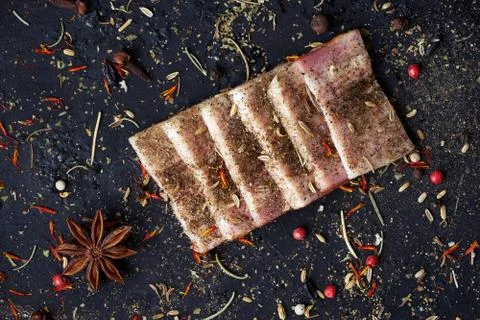 Closeup slices of breast with spices. Stock Photos
