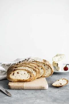 Closeup slices of wheat loaf on the table Stock Photos