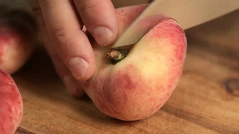 Closeup of slicing fig peach. Stock Footage 116822692