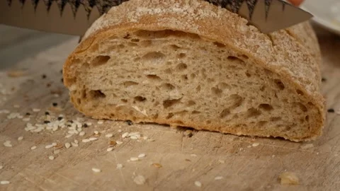 Closeup of slicing fresh bread Stock Footage 147143673
