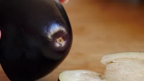 Closeup of Slicing a Fresh Eggplant Stock Footage 125120475