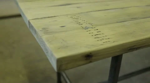 Closeup slider shot of a table made from reclaimed wood Stock Footage 58930328