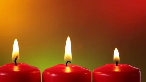 Closeup sliding in front of burning red christmas candles Stock Footage 81169588