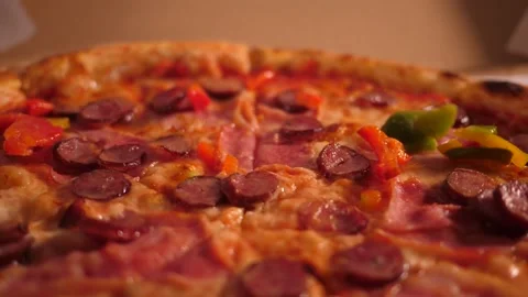 Closeup slow motion chef puts sprinkles bell pepper pieces on a pizza  cooking i Stock Footage 159087062