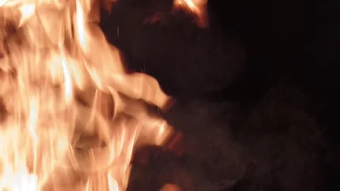 Closeup slow motion footage of the flames particles of a burning realistic .. Stockbeeldmateriaal 290841976