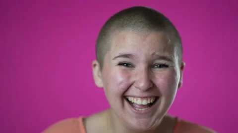 Closeup slow motion laughing and smiling gender fluid woman 20s years old posing Stock Footage 220856737