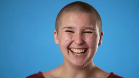 Closeup slow motion of laughing smiling young gender fluid woman 20s years old Stock Footage 222956282