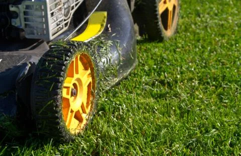 Closeup in Slow Motion of a Mower in Action Stock Photos