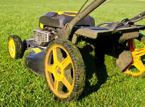 Closeup in Slow Motion of a Mower in Action Stock Photos
