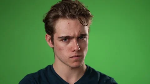 Closeup slow motion portrait of angry, upset, frustrated, young man 20s isolated Stock Footage 223525046